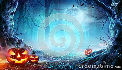 Jack Oâ€™ Lanterns In Spooky Forest At Moonlight Stock Photo